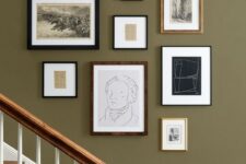 a vintage gallery wall with mismatching frames and artworks, black and white ones for a stylish look