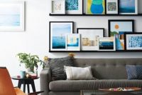 black gallery wall with colorful artworks