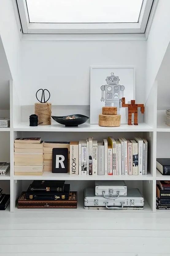 elegant open bookshelves under the roof are a veyr stylish and chic idea for a modern attic - display all the objects you want