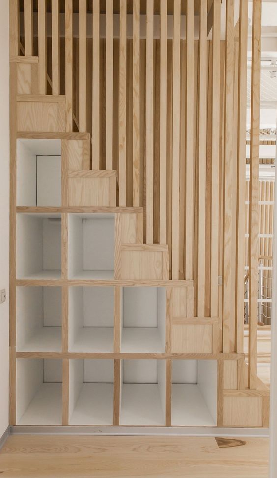 wooden staircase with storage drawers
