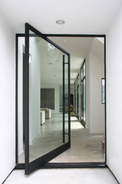 framed glass pivot front door