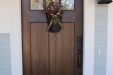 08 dark stained wooden door with a white trim for a contrast