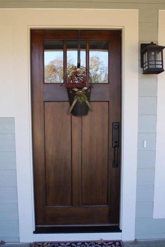 dark stained wooden door with a white trim for a contrast