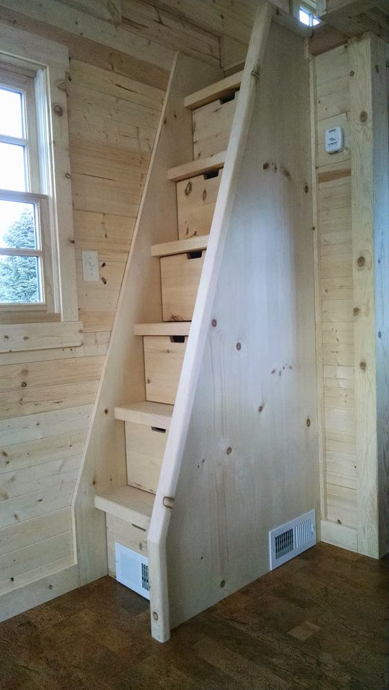 natural wood staircase for a tight space with storage drawers