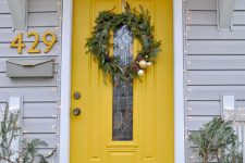 10 sunny yellow front door with a narrow pane