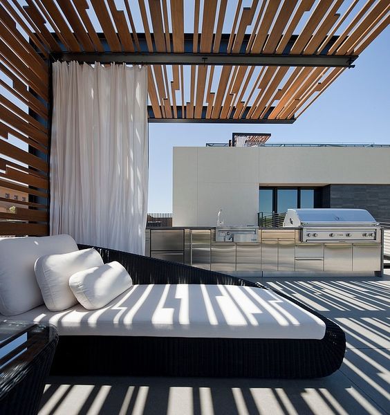 black woven daybed in a steel and timber cantilivered pergola