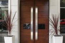 13 front wooden doors with glass panes and large handles