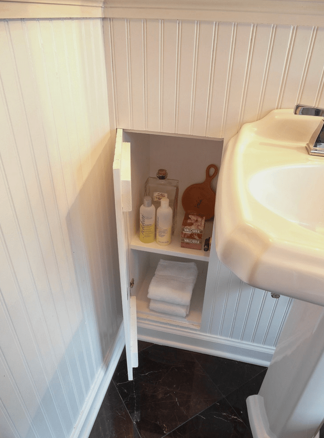 13 hidden panel to reveal bath products and supplies