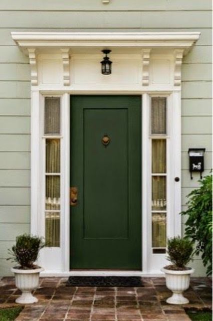 dark green door with white sidelights