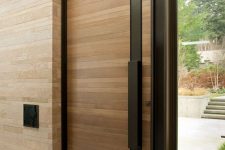 18 modern wood planks and steel front door with a sidelight