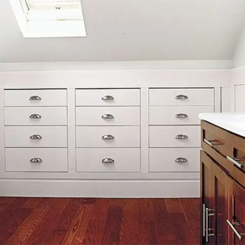 in-wall drawers in an attic bedroom