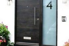 23 black wooden front door with an etched glass sidelight