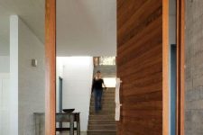 24 oversized wooden plank pivot front door