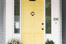 25 sunny yellow modern front door with yellow pots next to it