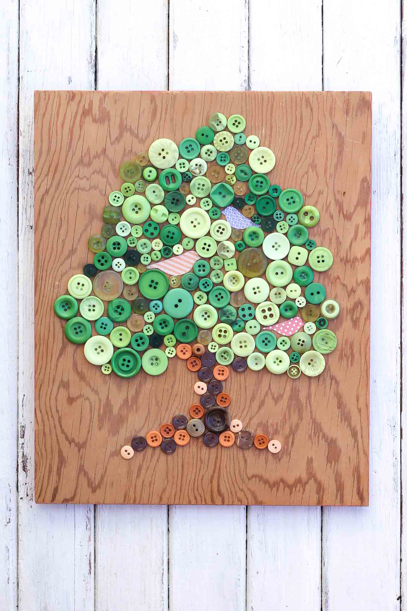 DIY tree wall art of buttons (via makeanddocrew)