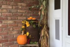 02 a porch dressed for fall with an old milk can, corn stalks and a crate