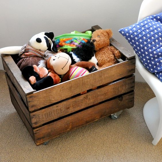 rustic wooden crate on wheels for mobile toy storage