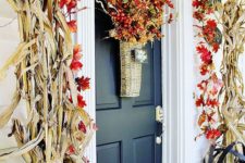 05 flanking your door with towering cornstalks is a bold seasonal statement