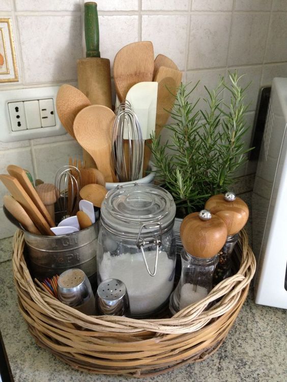 a basket can be used as a kitchen organizer, for spices, utensils and other stuff is a cool way tto add rustic charm