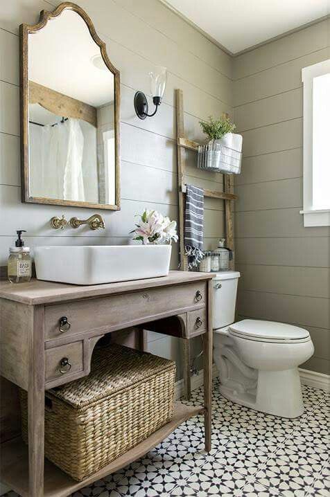 a large basket with a lid to store towels can be placed in a rustic or farmhouse bathroom, you can put it on a shelf or a vanity