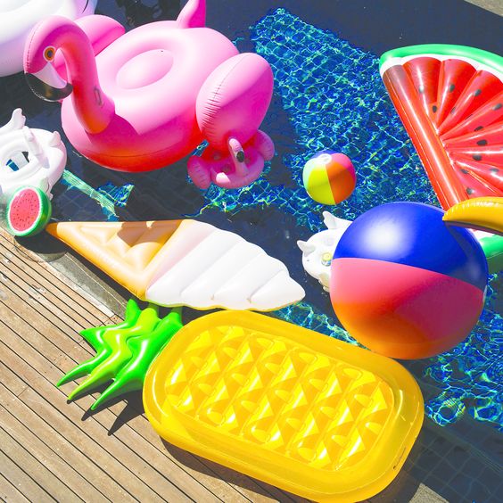 bold fruit floats and beach balls