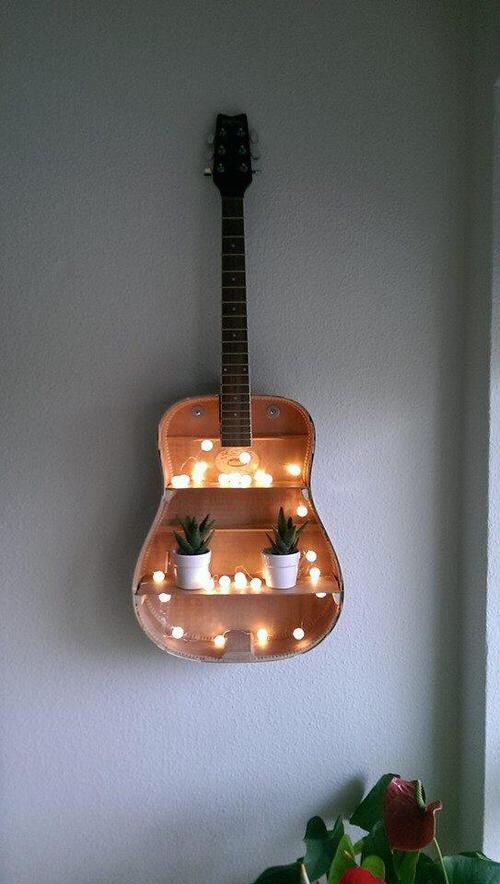 wall shelf made from an old guitar