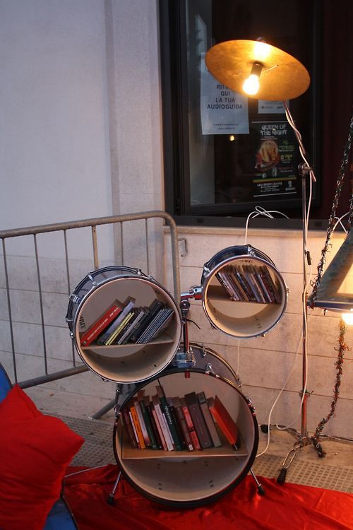 old drum kit turned into a bookshelf