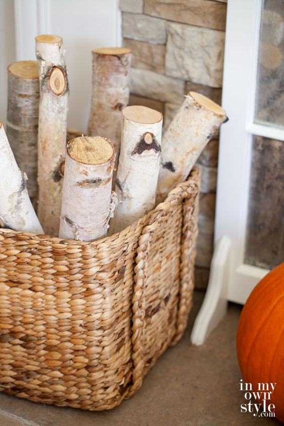 a basket with firewood is a creative and cozy rustic solution for the space, it will add coziness instantly