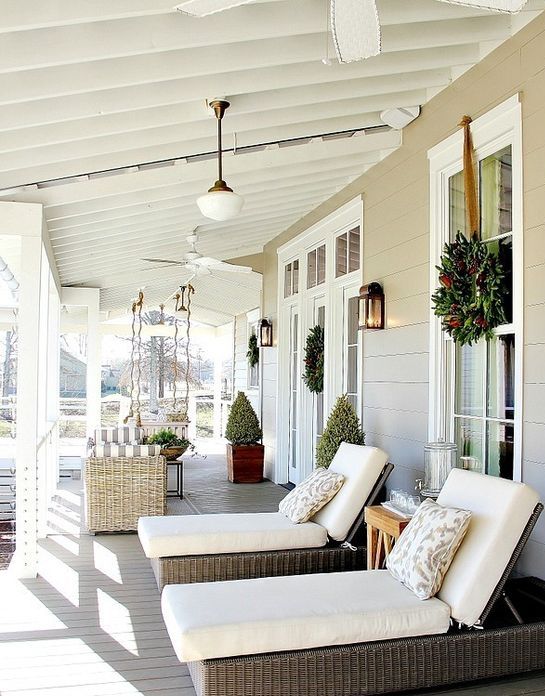 back porch with loungers and a swining sofa to sunbathe