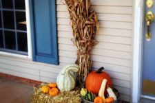 13 fall arrangement with pumpkins, gourds, hay and corn stalks