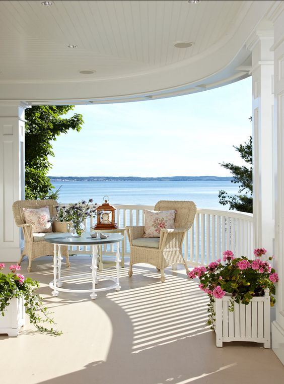 beachside netural-colored porch with potted flowers