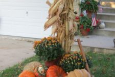 14 wooden wagon filled with mums and pumpkins, a corn stalk wrapped tree