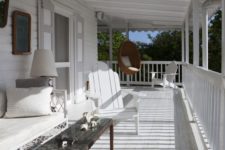 15 coastal-styled whitewashed porch with a wicker hanging chair