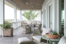 22 spacious serene second floor wraparound porch with wicker furniture