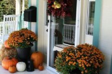 23 hay, mums and pumpkins for a rustic fall porch