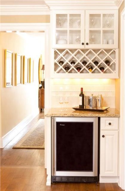 wine fridge and a liquor cabinet above