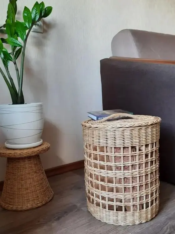 a cool wicker basket with a lid for storing pillows or blankets, and it can double as a side table in a rustic space
