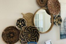 a gallery wall of painted baskets, a round mirror is a cool decoration for a boho space, make one yourself