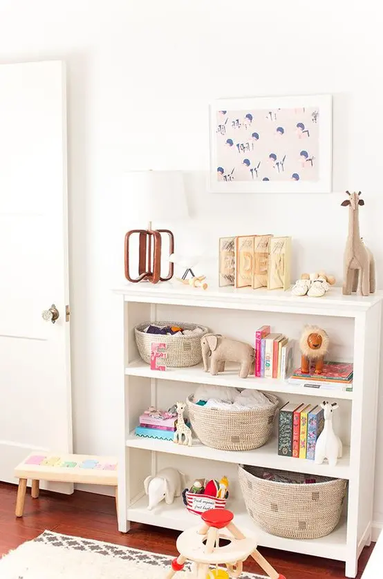 a small open dresser in white with round wicker cubbies is great for a nursery or a kid's room