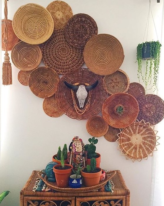 a wicker cabinet with cacti and a wall basket composition with a faux skull for a desert feel