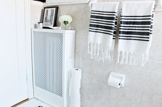 DIY all-white radiator cover with a decorative metal sheet (via www.ehow.com)