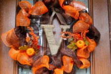 DIY brown and orange deco mesh wreath with a twine letter