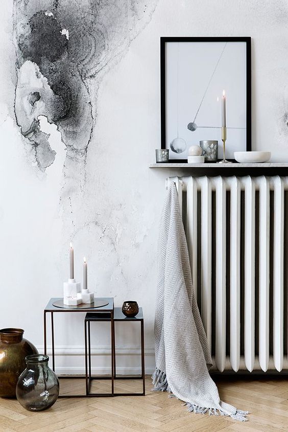 a narrow wall mounted display shelf above the radiator is a cool idea for a Scandinavian space, it's a smart and cool idea
