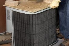 DIY AC condenser cover unit of plywood