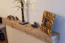 a pallet radiator shelf used for displaying things is a great way to upcycle an old pallet or another old piece of wood