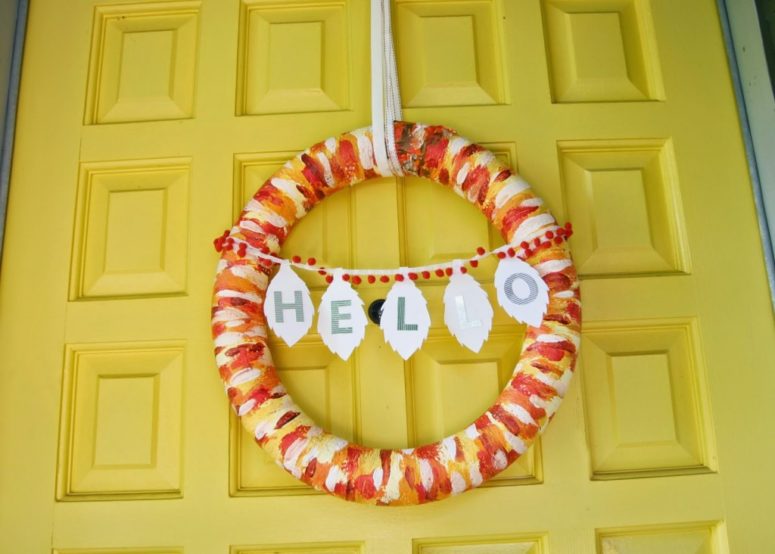 DIY brush stroke pool noodle wreath. In these color would work great as the fall wreath. (via www.homemadeginger.com)