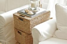 stacked baskets double as a side table, with seashells, a candle and a book are a great idea for a rustic space