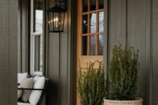 tall baskets covering the planters add a soft farmhouse touch to the porch