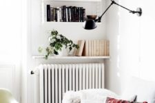a wall-mounted shelf as an additional book shelf, it echoes with their design and looks cohesive in the space