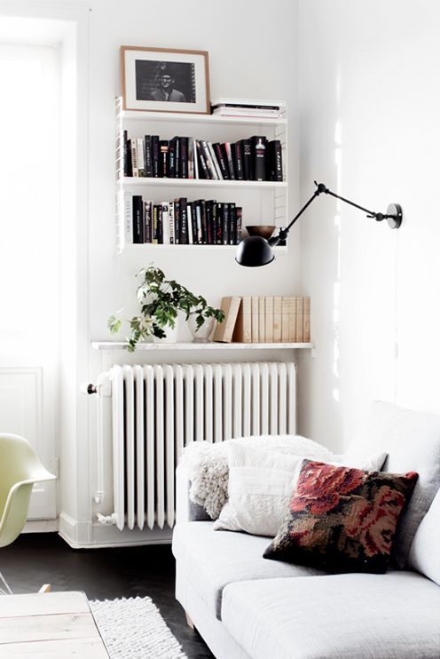 wall-nounted shelf as an additional book shelf